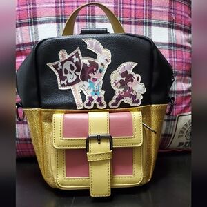 Pirates Of The Carribbean Mini Crossbody Backpack in Black Gold